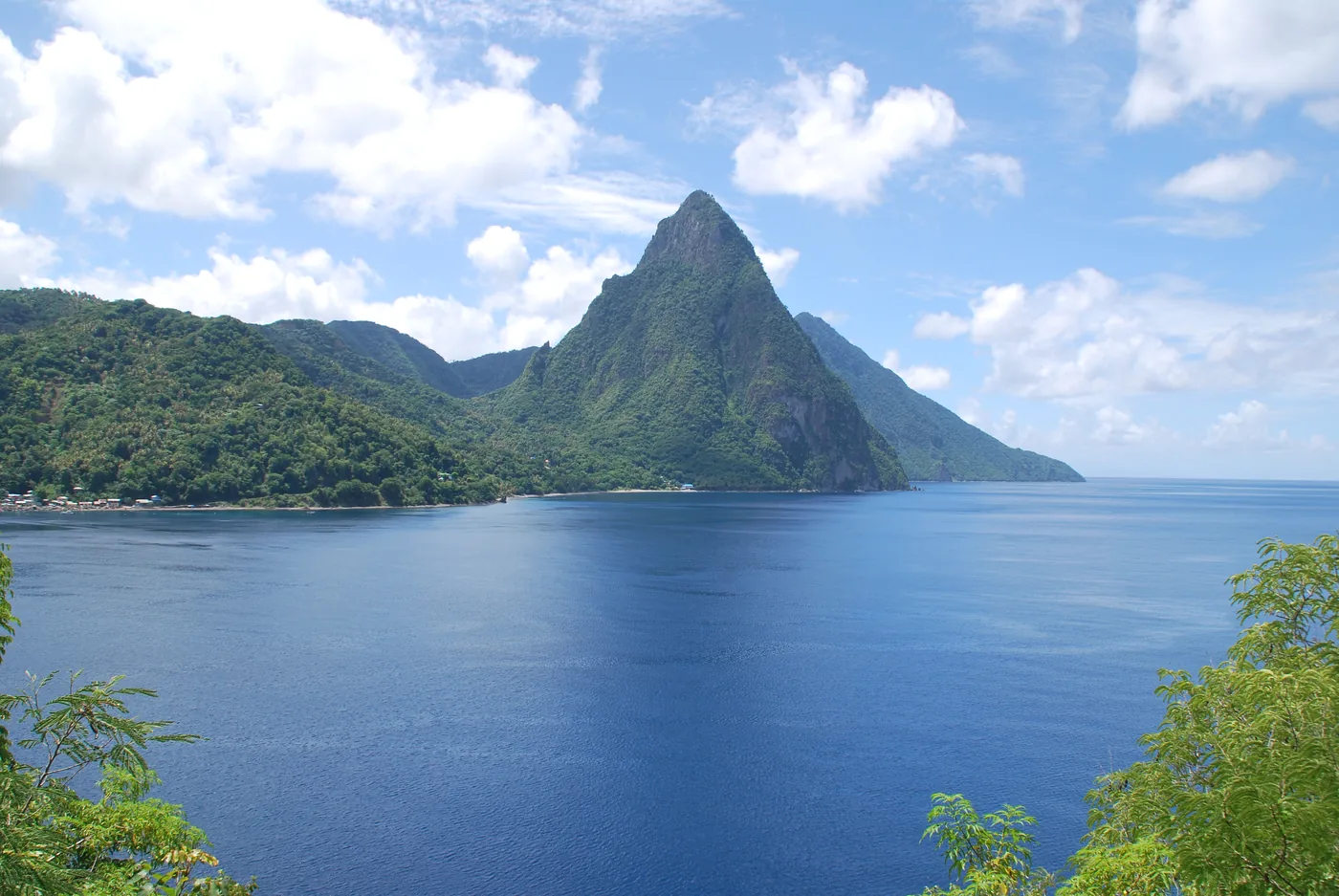 The steep green cone of Petit Piton above the sea on the west coast of Saint Lucia